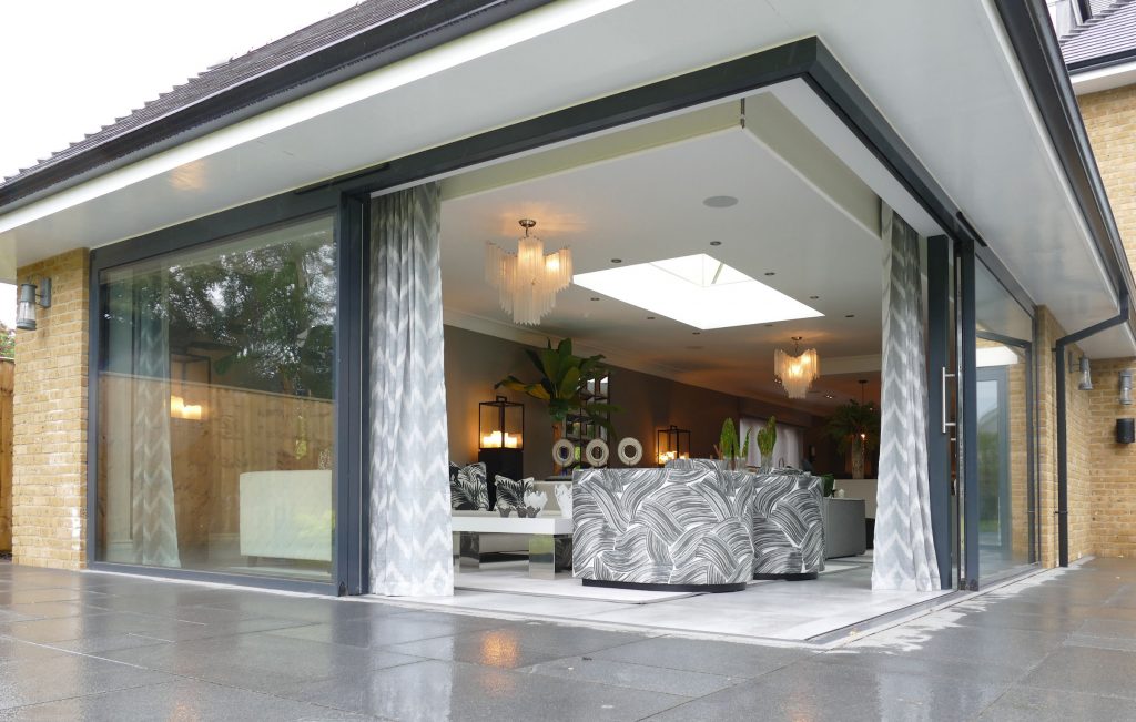 low or flush threshold for bifolding or sliding doors showing image of a corner set of patio doors