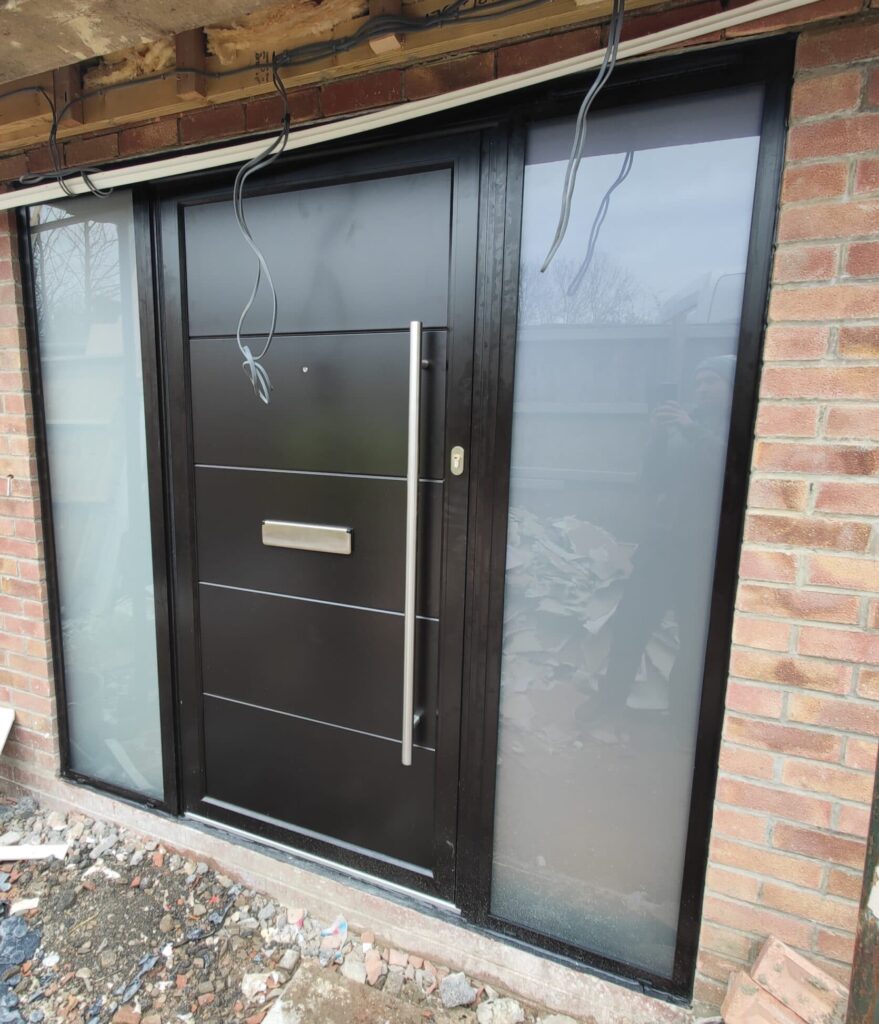 black modern front door in a new build home