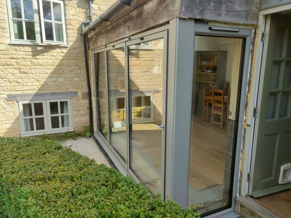 Schuco bifold doors in a corner design to a new house