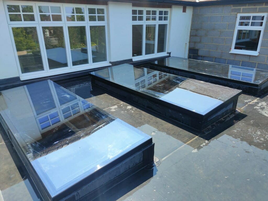 frameless glass rooflights on a flat roof extension