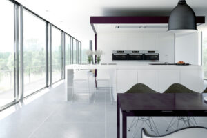Silver slimline sliding doors in a black and white contemporary kitchen